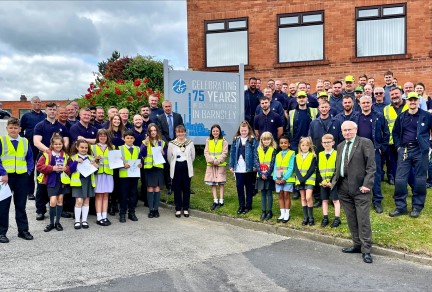 Group of employees and local school kids outside the facility in Barnsley, UK