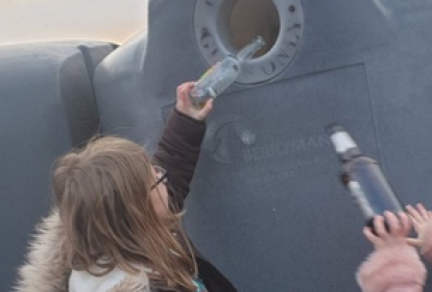 Children at the glass recycling bottle bank